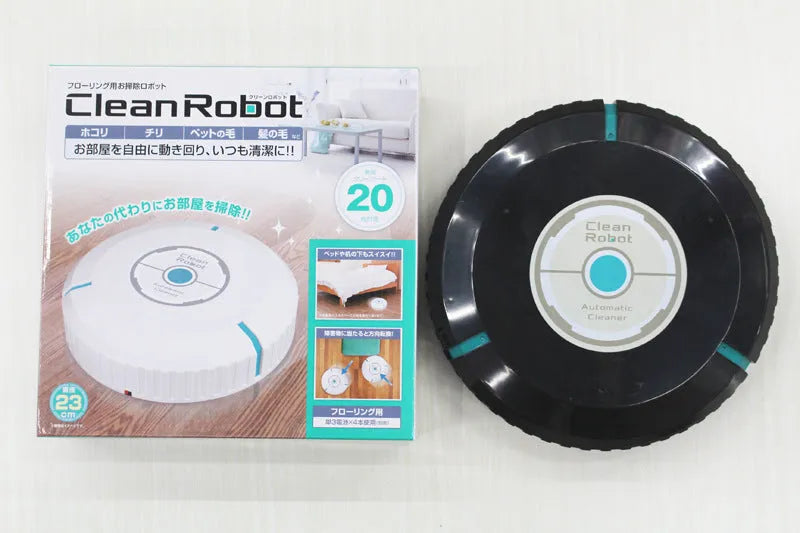 Black and white AC robot vacuum cleaner on wooden floor
