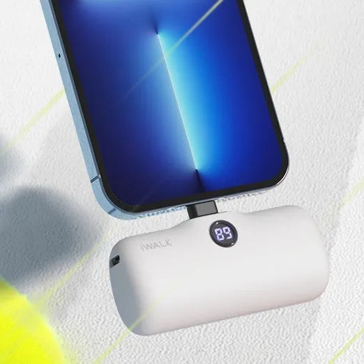 Compact lipstick-shaped portable power bank in multiple colours showing size and display screen