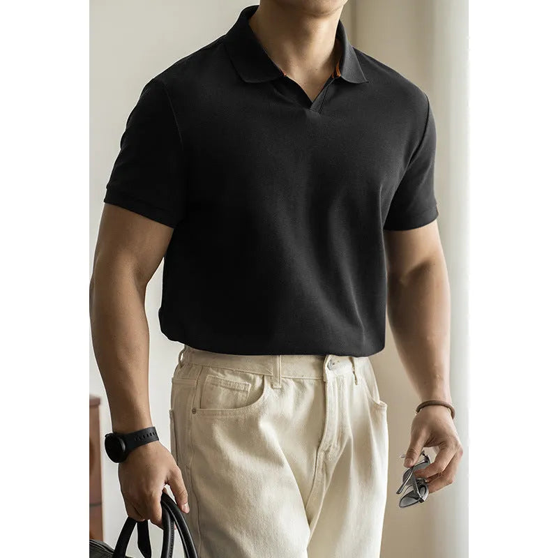 Man's short-sleeve blue polo shirt on a hanger, showing the classic collar and button placket.