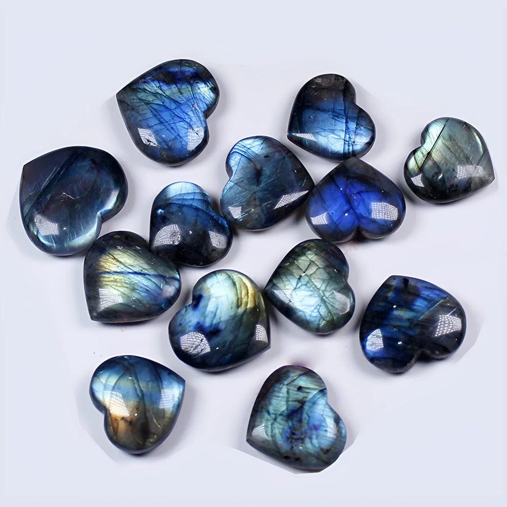 Natural blue feldspar heart-shaped handle play piece pendant on a white background.