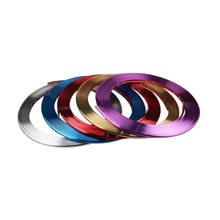 Roll of electroplated purple PVC wheel hub trim and a separate anti-collision strip on a white background.