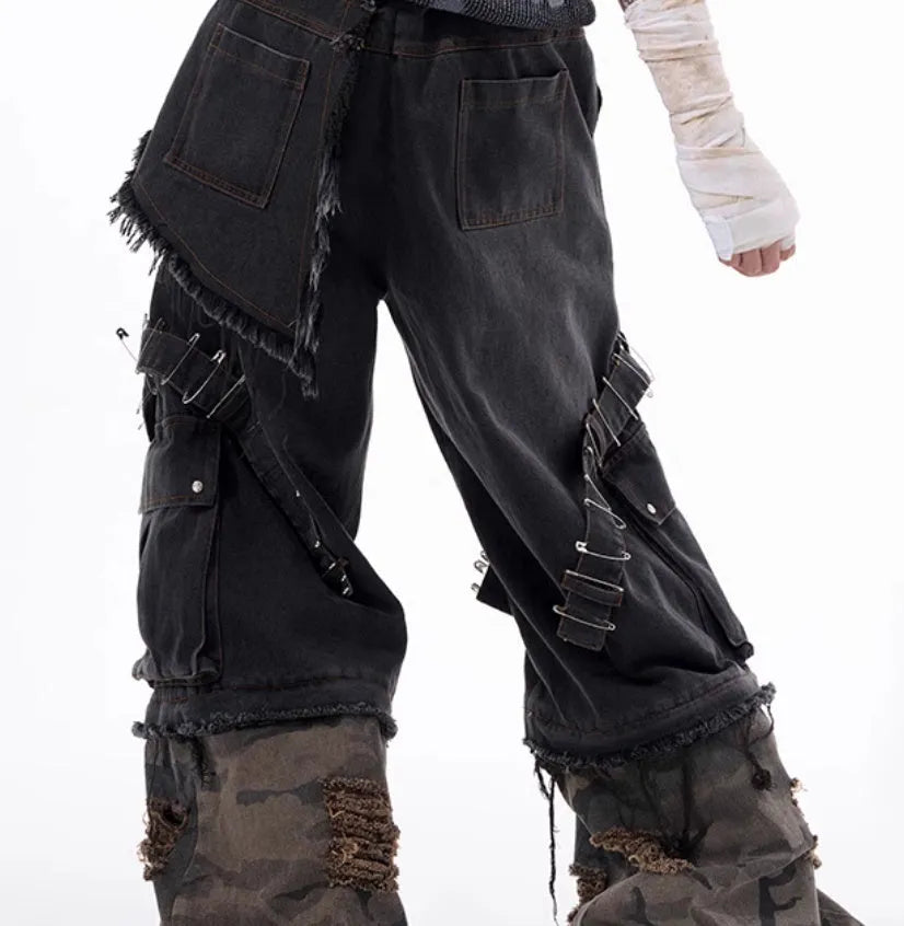 Men's grey camouflage jeans with splicing panels and ribbon detail on cotton denim.