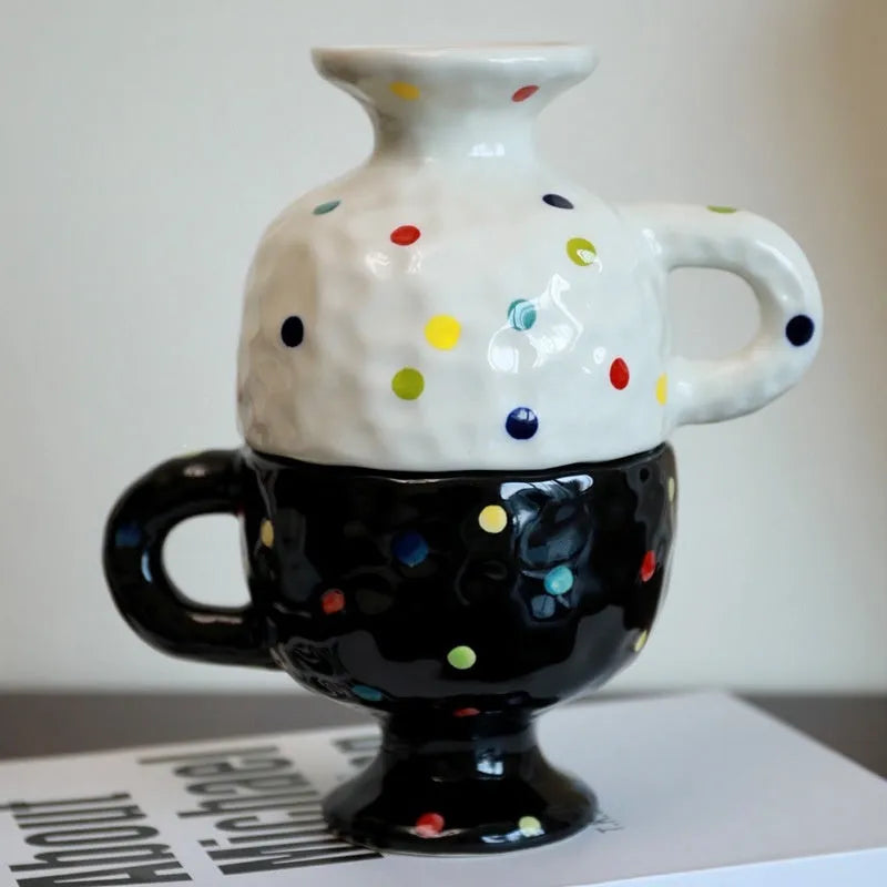 A hand-pinched irregular shaped ceramic mug in a solid colour, shown on a plain background.