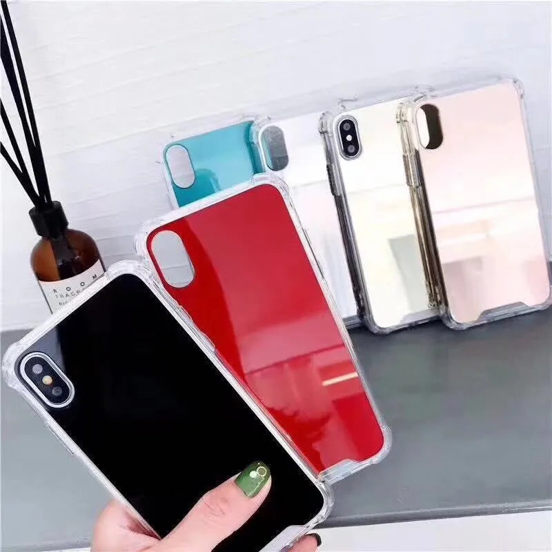 Soft TPU Mirror Phone Case for iPhone in multiple colours on a table.
