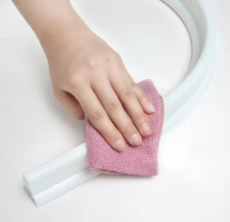 Flexible silicone bathroom water blocking strip in white, black, and grey colours showing 30mm width dimension