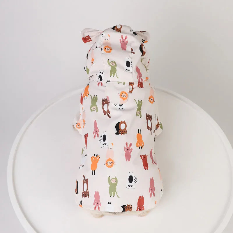 Beige cartoon print dog raincoat with double waterproof PU coating shown on a model dog.