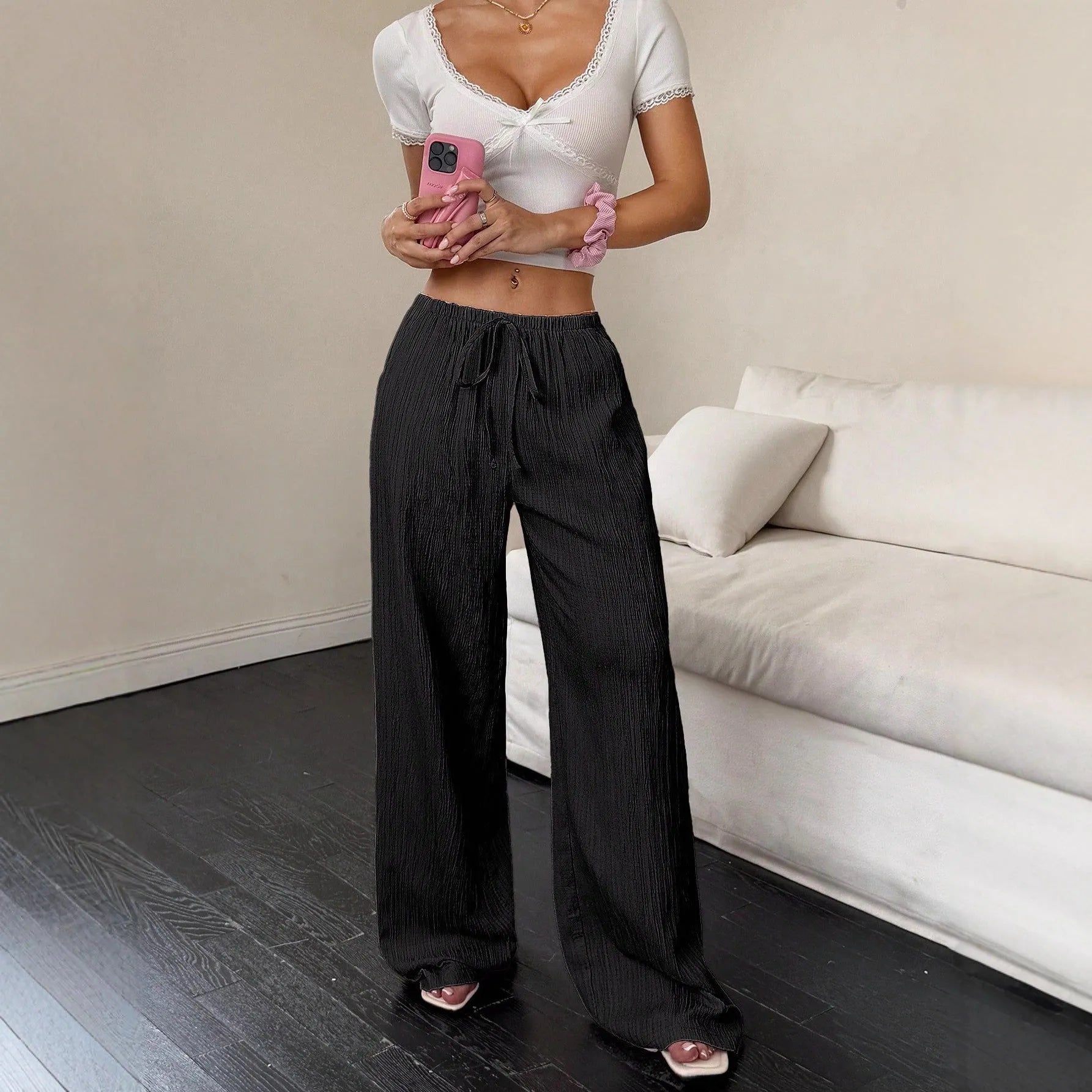 Women's wide leg trousers with lace-up waist detail in black or pink polyester fabric