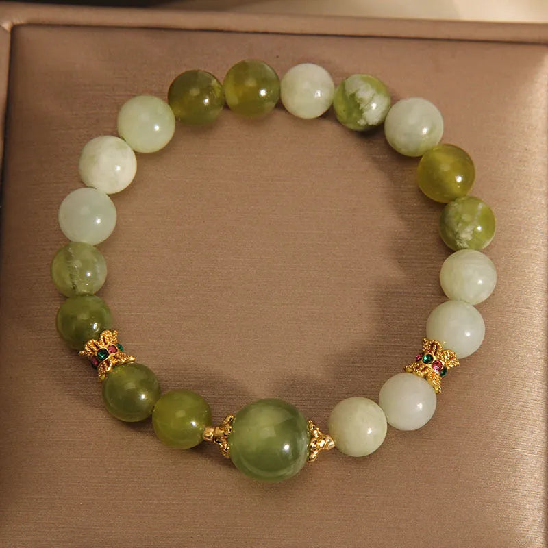 Women's bracelet made of natural green Xiuyan jade in a sweet Mori style.