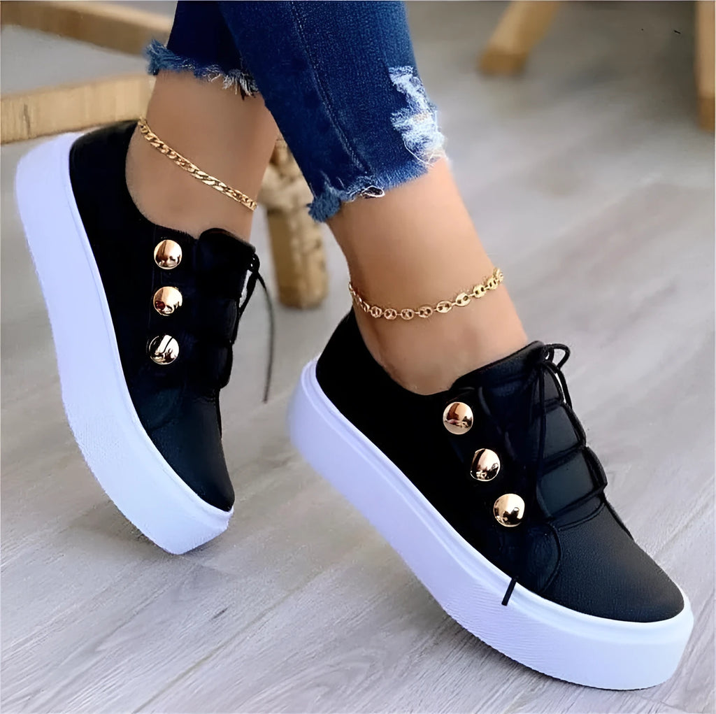 Women's white lace-up flats sneakers with rivet details and round toe design