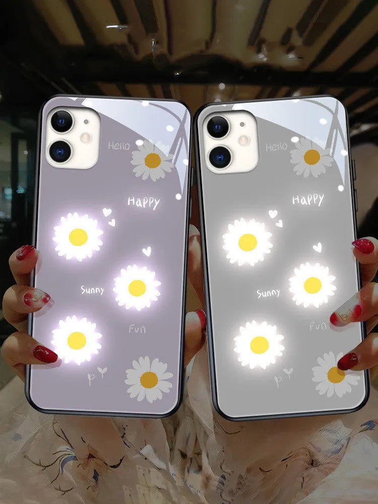 Luminous iPhone case with voice-activated colour light showing white daisy pattern on TPU protective shell