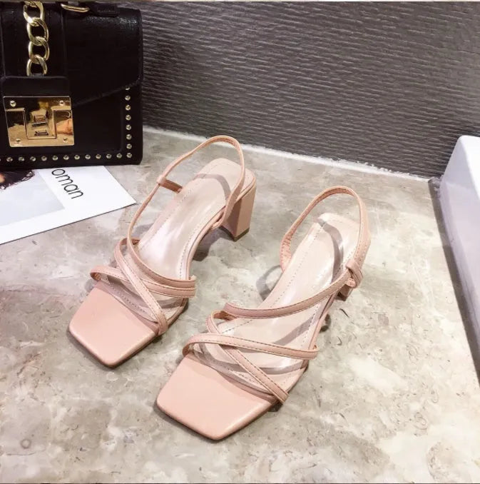 Women's thick heel sandals in white colour with over 8cm middle heel and sleeve wearing mode