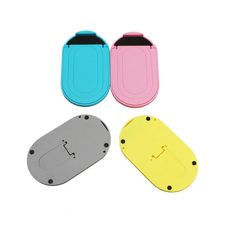 Plastic lazy bracket mobile phone stand showing 360-degree rotation adjustment in multiple colour options