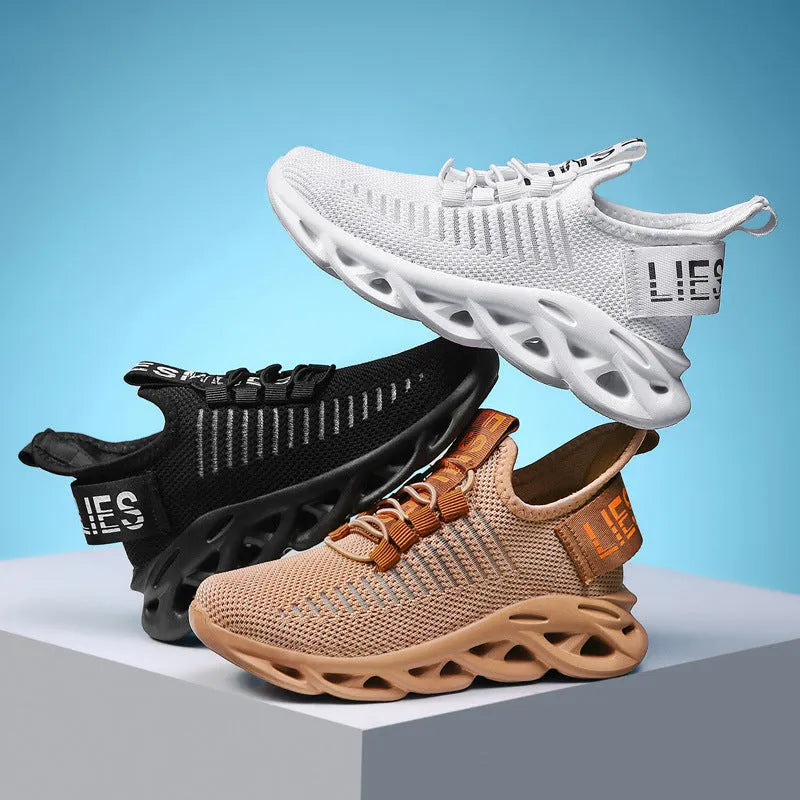 Children's Velcro sneakers in black, khaki, or white with fabric upper and textured sole.
