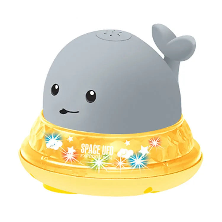 Electric whale bath toy spraying water with flashing LED lights in baby bath