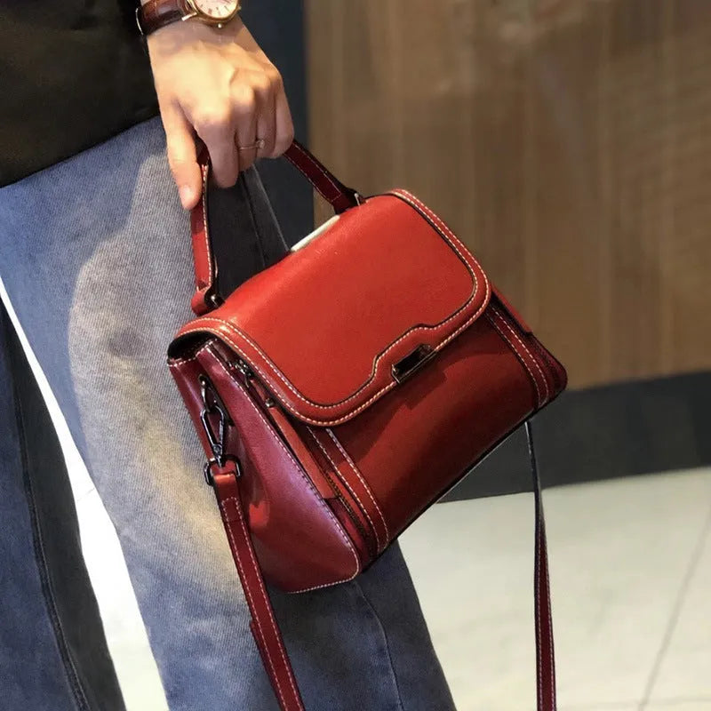 Women's genuine leather messenger bag in retro styling with multiple internal compartments