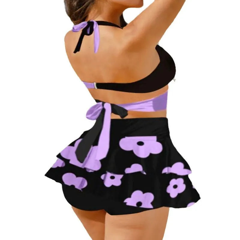 Purple high-waisted women's bikini swimsuit with lace-up detail and split skirt, showing backless design