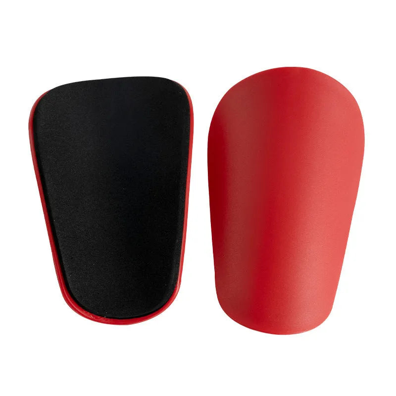 PU mini shin guards for sports protection in black, white, red, and blue colours.