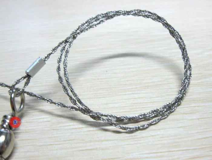 Portable outdoor wire saw with stainless steel blade and pull rings for camping cutting