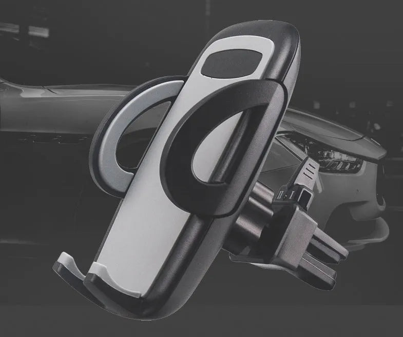 Black mobile phone holder clipped to car air conditioning vent with smartphone mounted
