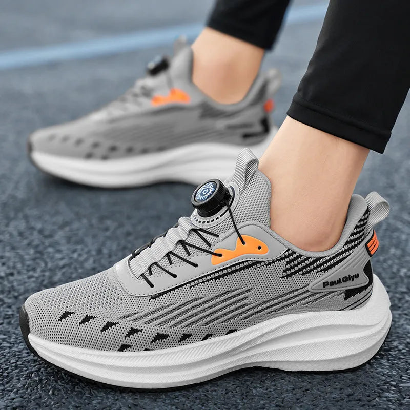 Men's black casual sports shoes with rotating buckle closure and mesh upper on a TPU sole.