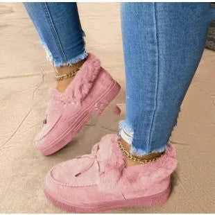 Cotton loafer shoes with a velvet lining, round toe, and textured rubber sole in a light pink colour.