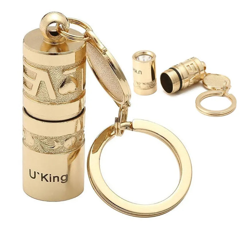 Gold-coloured zinc alloy keychain torch with LED light on a keyring.