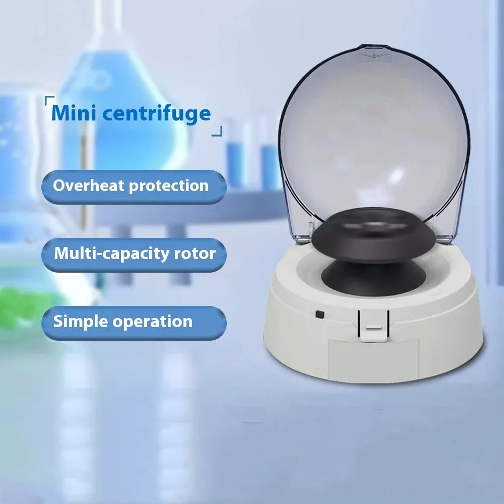 Small white laboratory mini centrifuge unit on a benchtop.