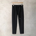 Boys slim straight wool trousers in grey, showing tapered fit and straight leg opening.