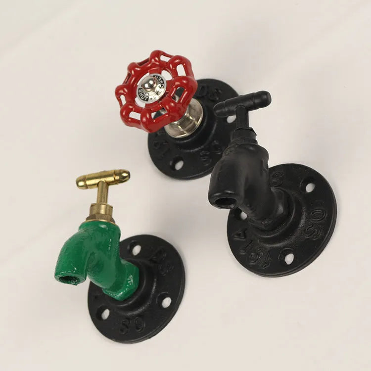 Water pipe style metal towel rack hook in black, green, or red on a white wall
