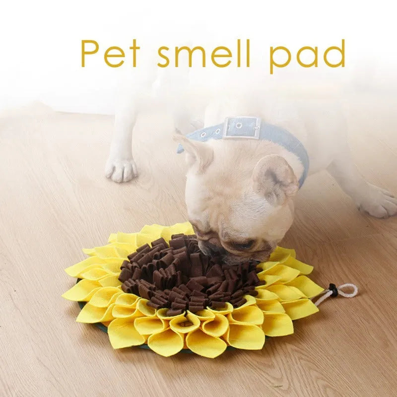 Yellow sunflower-shaped dog snuffle mat with fleece texture and a buckle strap for non-slip use.