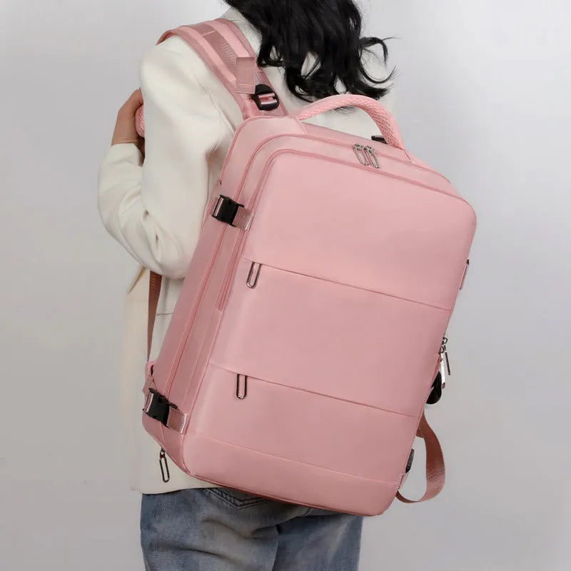 Large purple travel backpack with multiple compartments and air pillow belt system