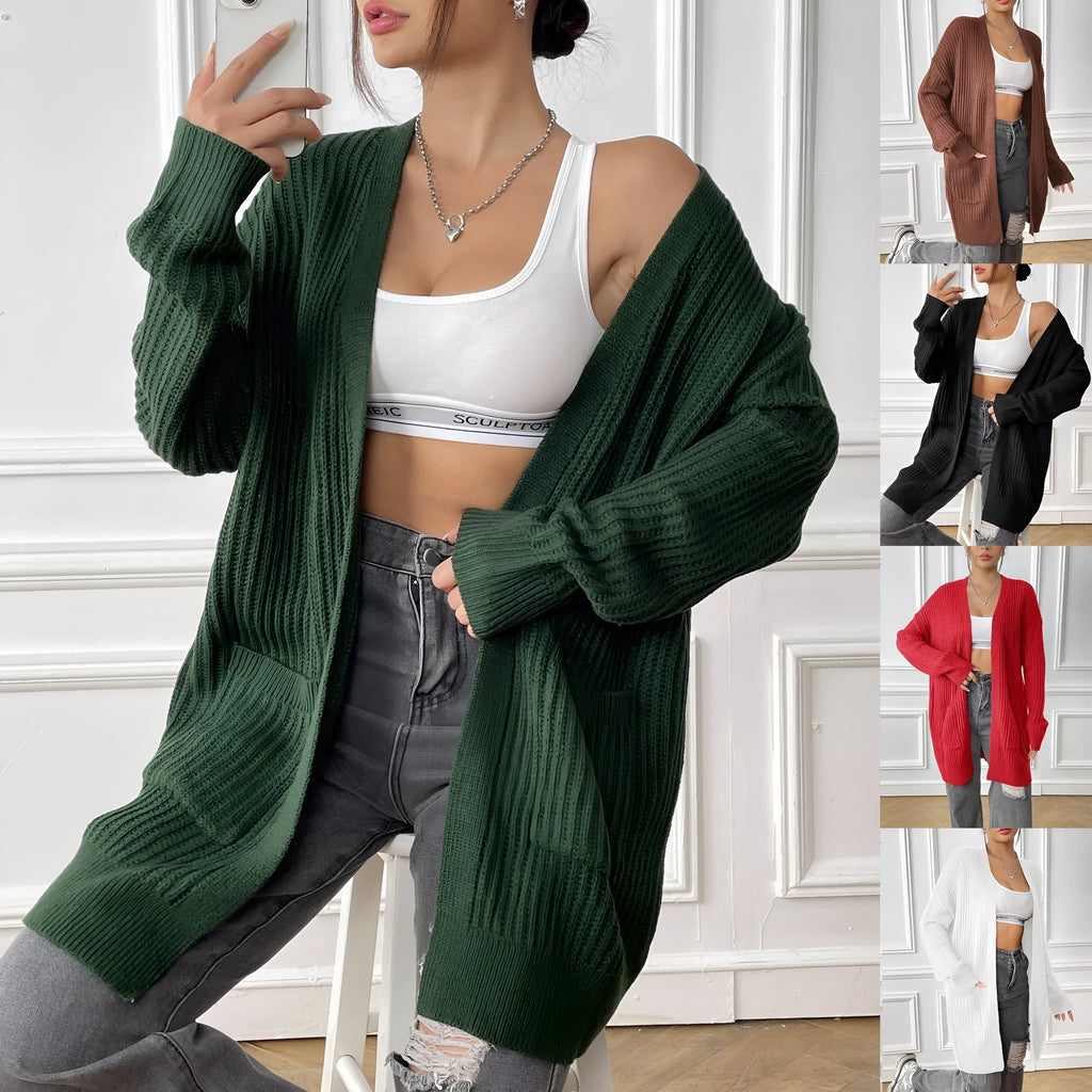 Women's dark green acrylic cardigan with two front pockets and long sleeves on a hanger.