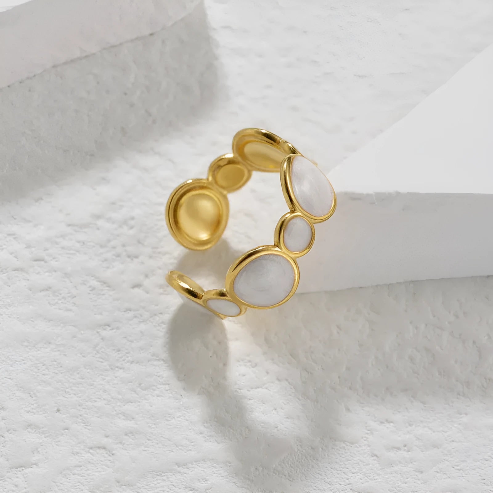 Simple stainless steel geometric ring for women with an adjustable opening.