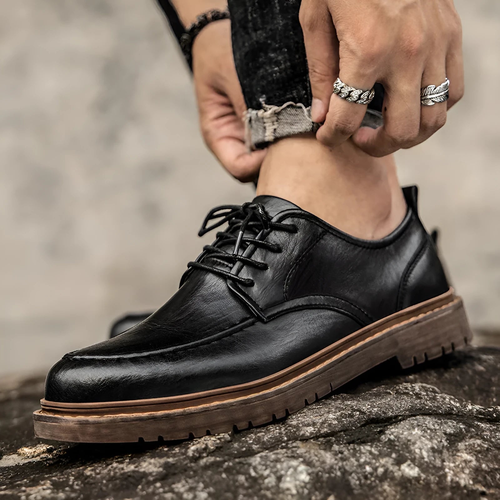 Men's black and brown leather casual shoes with round toe and flat rubber soles