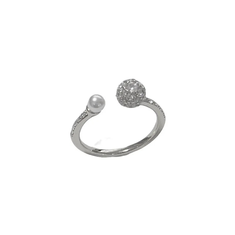 Open-end pearl ring with round zircon decoration in gold or silver colour with thick real gold plating