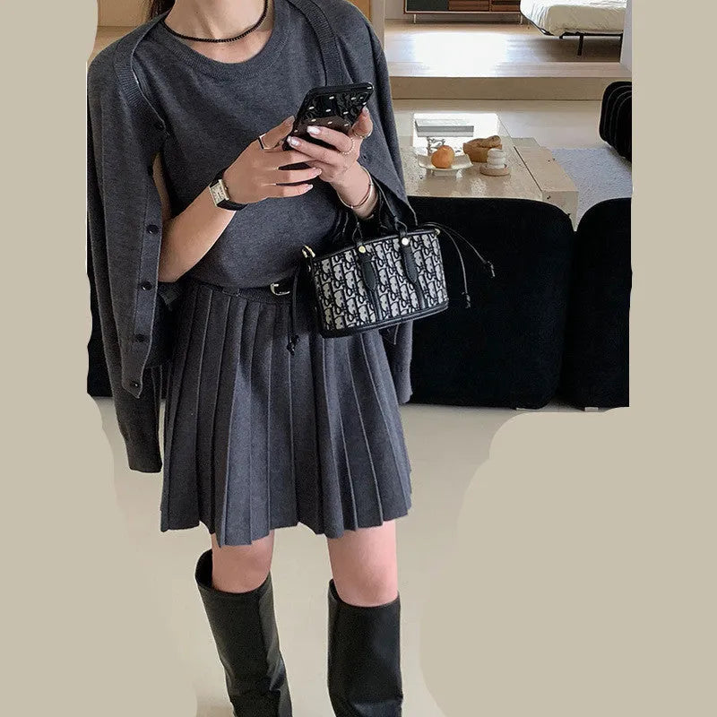 Grey art retro women's vest skirt and long-sleeve cardigan two-piece set with pleats and belt.