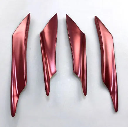 Set of four carbon fibre pattern automotive bumper blades mounted on vehicle