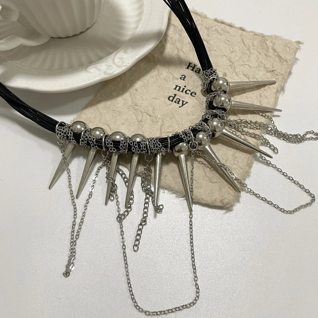 Women's casual leather necklace with winding round beads, tassel pendant, and silver rivet details