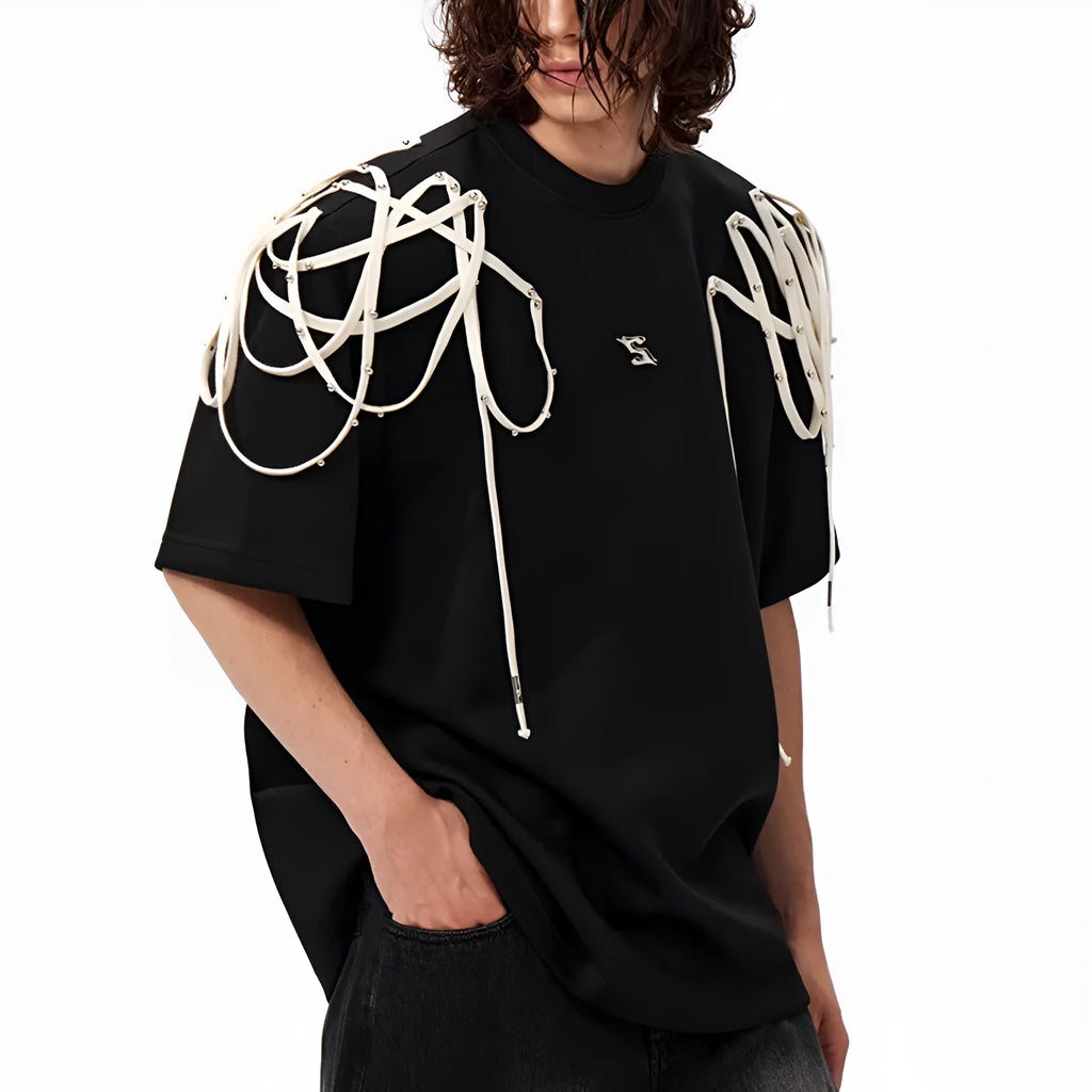 Black rivet ribbon padded shoulder short-sleeved T-shirt on hanger showing loose fit