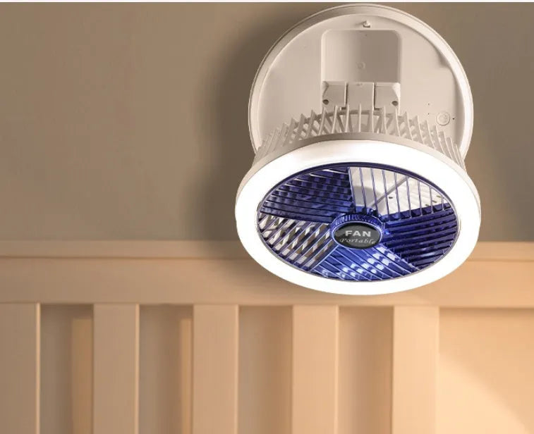 Blue foldable USB desk fan with LED light shown in open position on a table