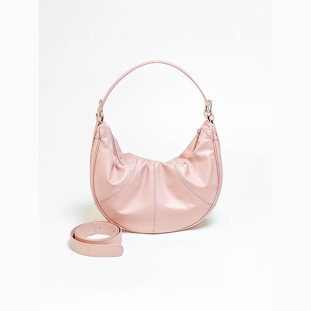 Women's soft cowhide leather shoulder bag in dumpling shape showing double straps and sandwich pocket.