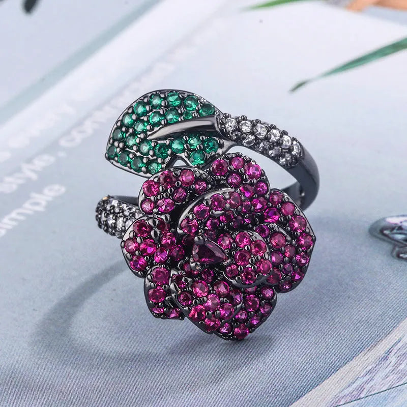 Black gold geometric flower ring with diamond-treated simulation red corundum stone