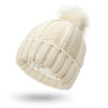 Women's wool beanie hat with satin lining and a faux fur pom pom in a choice of eight colours.