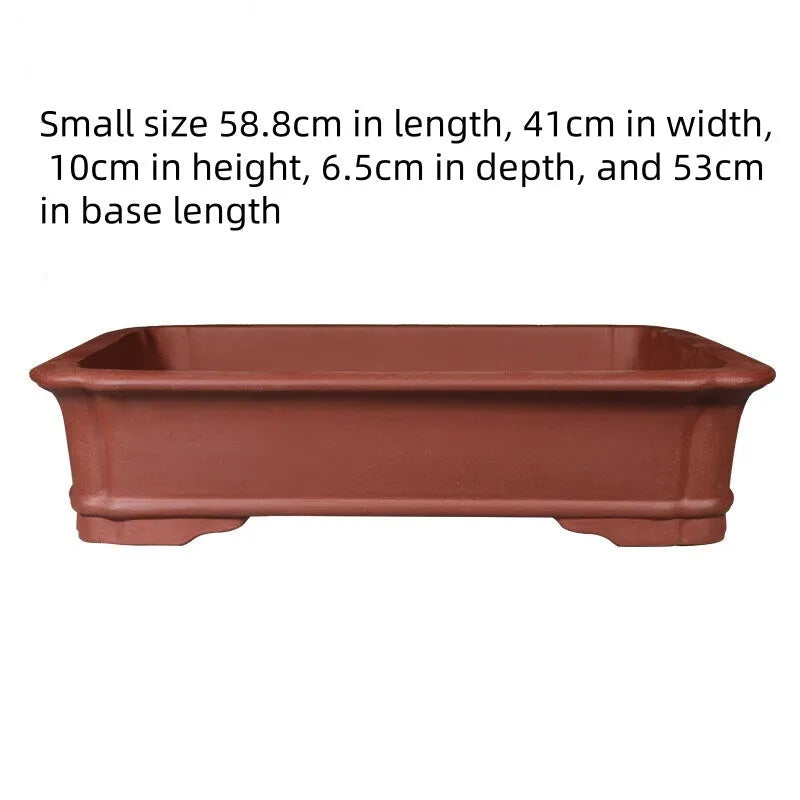 Large rectangular handmade purple clay flowerpot for bonsai or garden plants.