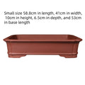 Large rectangular handmade purple clay flowerpot for bonsai or garden plants.