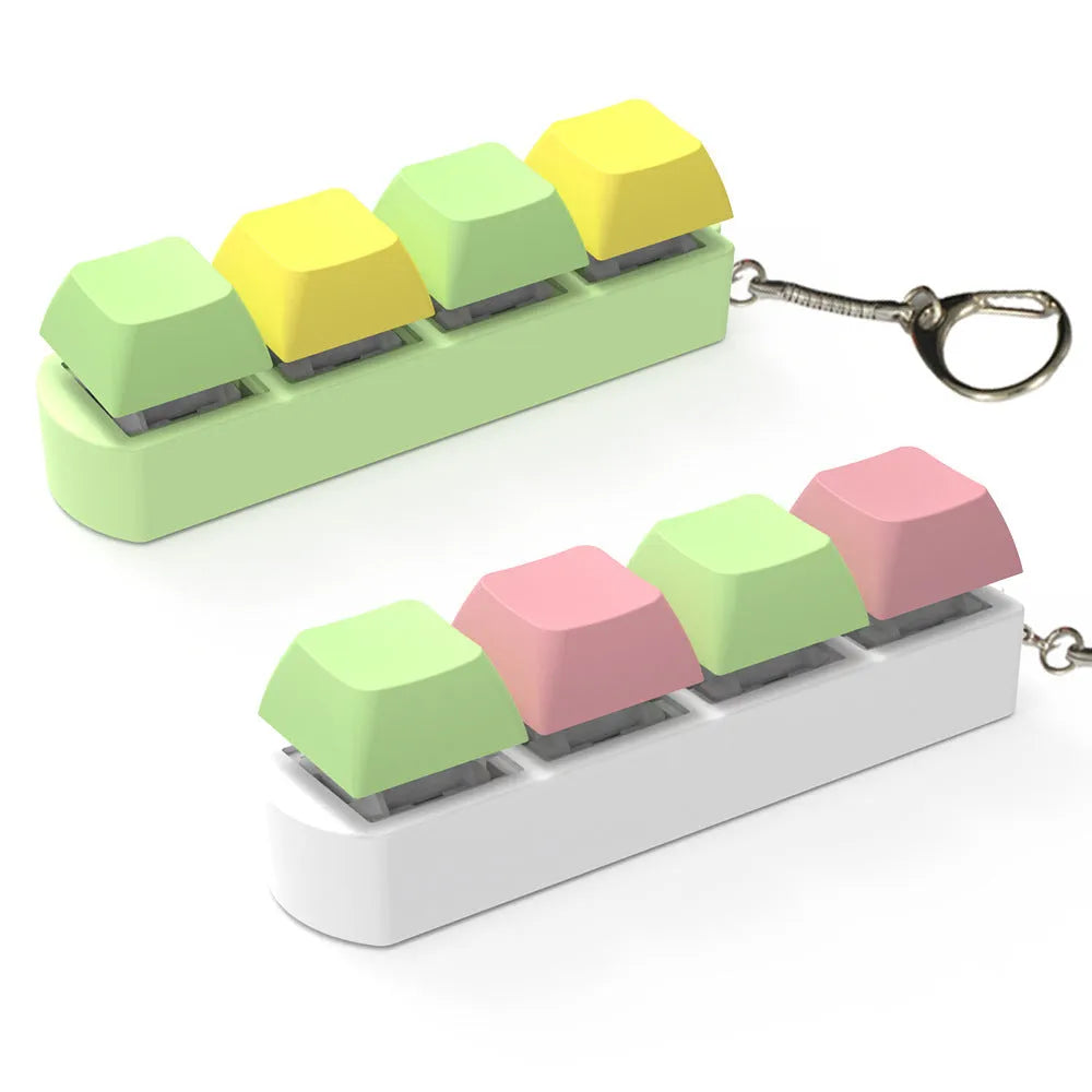 A compact mechanical keyboard switch tester with four different coloured keycaps and an included keycap puller.