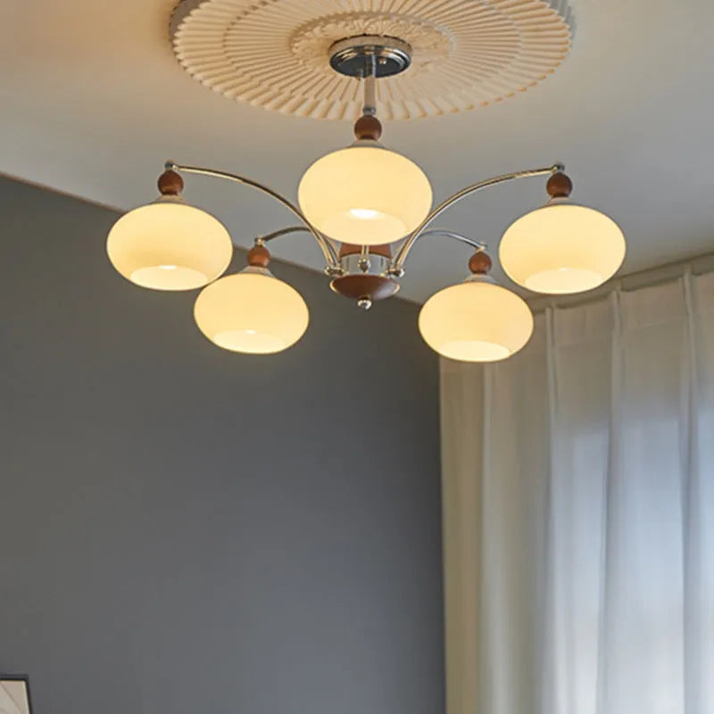 Persimmon glass ceiling chandelier with chrome frame and multiple glass lampshades in a Middle Ancient style.