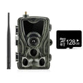 Outdoor camouflage surveillance camera with wide-angle lens mounted on an exterior wall.