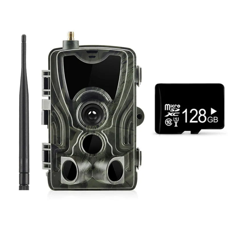 Outdoor camouflage surveillance camera with wide-angle lens mounted on an exterior wall.