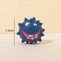 Four coloured natural latex squeaky dog balls with cute faces measuring 7.5cm